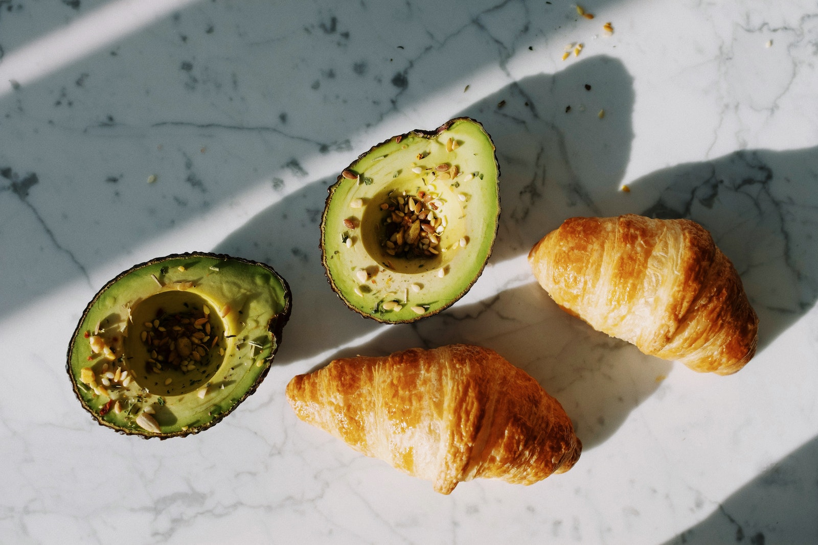 Sliced Avocado Fruit On White Surface