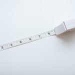 a white measuring tape with a white background