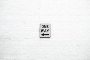 One Way arrow left signage